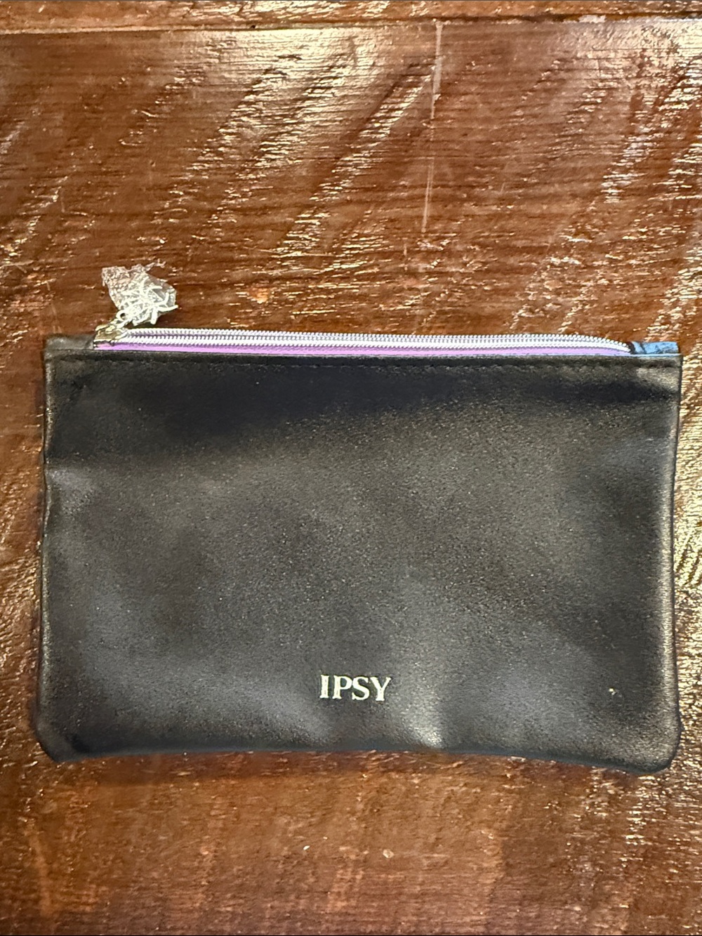 ipsy Black Satin Cosmetic Pouch with Purple Zipper and spider web on back